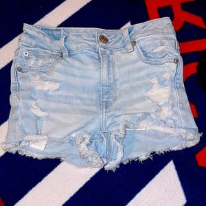 High waisted distressed blue Jean shorts from American eagle.